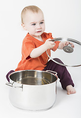 Image showing baby with big cooking pot