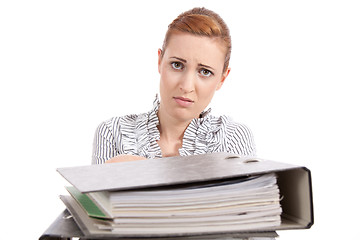 Image showing business woman in office looks at unbelievable folder stack