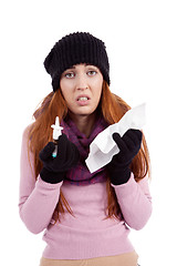 Image showing woman with tissue and spray feels unwell with flu