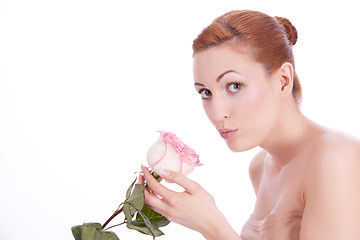 Image showing beautiful young woman holding pink rose isolated