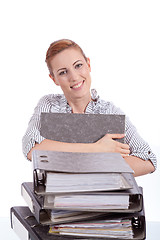 Image showing business woman in office looks at unbelievable folder stack