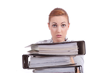 Image showing business woman in office looks at unbelievable folder stack