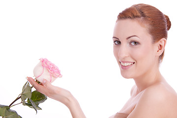 Image showing beautiful young woman holding pink rose isolated