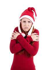 Image showing smiling young woman at christmastime in red clothes isolated