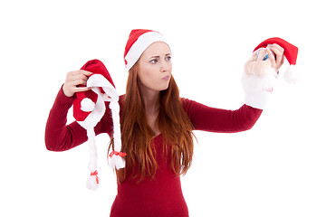 Image showing smiling young woman at christmastime in red clothes isolated