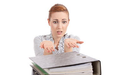 Image showing business woman in office looks at unbelievable folder stack