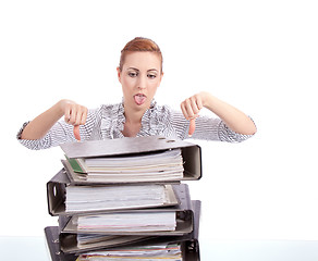 Image showing business woman in office looks at unbelievable folder stack