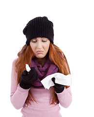 Image showing woman with tissue and spray feels unwell with flu