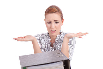 Image showing business woman in office looks at unbelievable folder stack