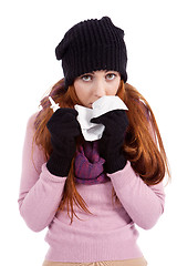 Image showing woman with tissue and spray feels unwell with flu