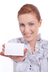 Image showing beautiful young girl is holding a blank card in hand isolated