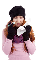 Image showing woman with tissue and spray feels unwell with flu