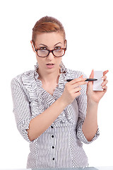 Image showing beautiful young girl is holding a blank card in hand isolated