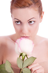 Image showing beautiful young woman holding pink rose isolated