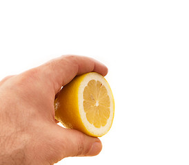 Image showing fresh half lemon on hand