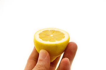 Image showing fresh half lemon on hand