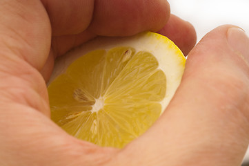 Image showing fresh half lemon on hand