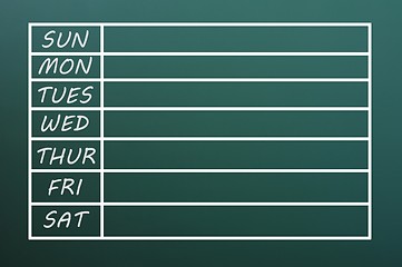 Image showing Blank weekday calendar form written with chalk on green chalkboard