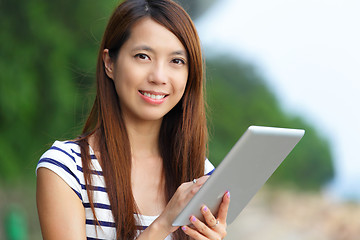 Image showing asian woman using tablet computer