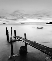 Image showing pier at sunset in black and white