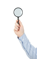 Image showing  hand holding magnifying glass