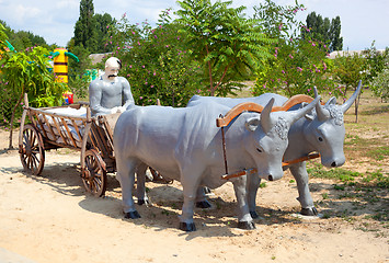 Image showing Monument to Cossack in a cart with the bulls