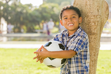 Image showing Mixed Race Boy Holding Soccer Ball in the Park