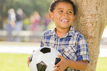 Image showing Mixed Race Boy Holding Soccer Ball in the Park