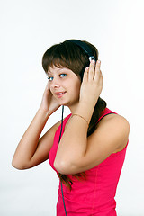 Image showing attractive young girl listening to music