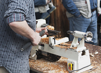 Image showing Man making wooden toy