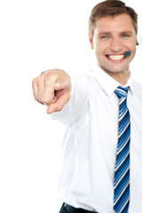 Image showing Cheerful male executive pointing at you
