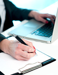 Image showing Closeup of woman copying data from laptop