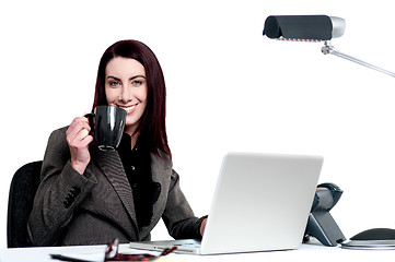 Image showing Its time for a break. Woman enjoying coffee