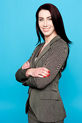 Image showing Attractive woman standing with crossed arms