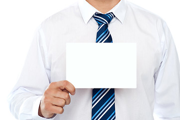 Image showing Business executive showing placard. Closeup shot