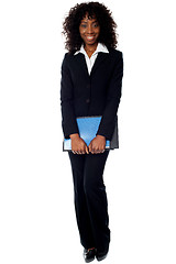 Image showing African businesswoman carrying documents