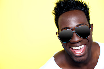 Image showing Closeup of joyful young african guy in sunglasses