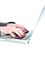 Image showing Female hands operating laptop. Cropped image