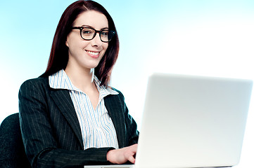 Image showing Young business executive working on laptop