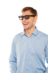 Image showing Joyful young man wearing goggles looking away