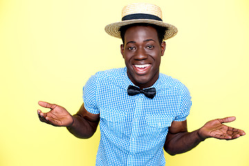 Image showing Young african guy with hat enjoying himself