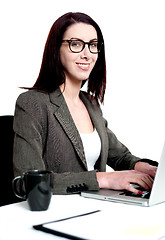 Image showing Beautiful businesswoman working on laptop