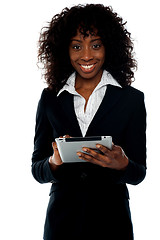 Image showing Young businesswoman using wireless tablet pc