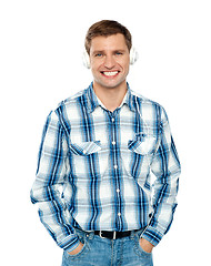 Image showing Casual caucasian guy listening to music