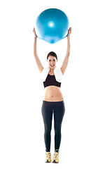 Image showing Gorgeous fit lady holding pilate ball