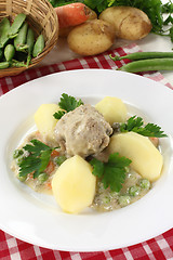 Image showing cooked meatballs in a white sauce with capers