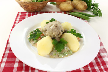 Image showing cooked meatballs in a white sauce with capers