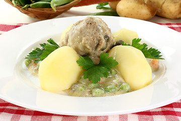 Image showing cooked meatballs in a white sauce with capers