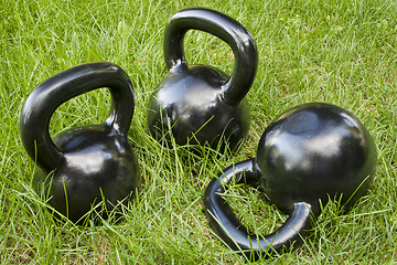 Image showing heavy kettlebells in grass