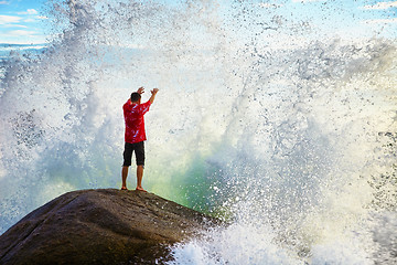 Image showing Man prays sea elements